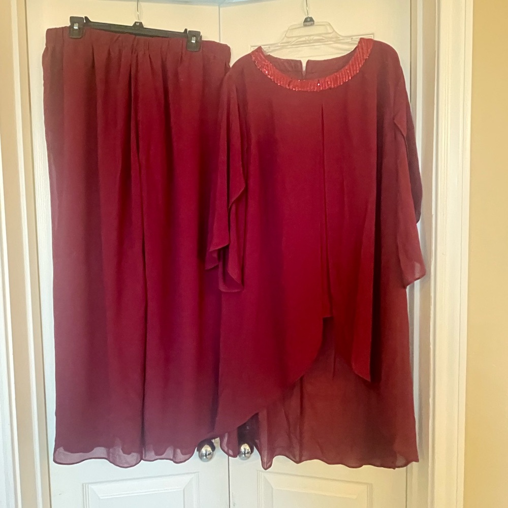 Women’s burgundy two piece pant suit.